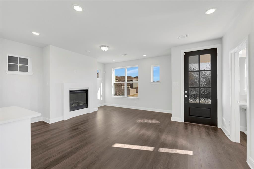 3501 Pineda Way McKinney, TX 75071 - Photo 10 of 40 a view of an empty room with wooden floor and a window