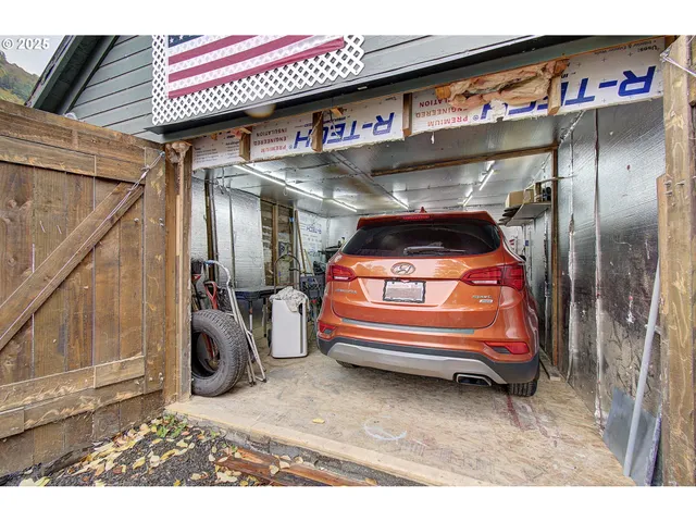 a utility room with multiple dryer and washer