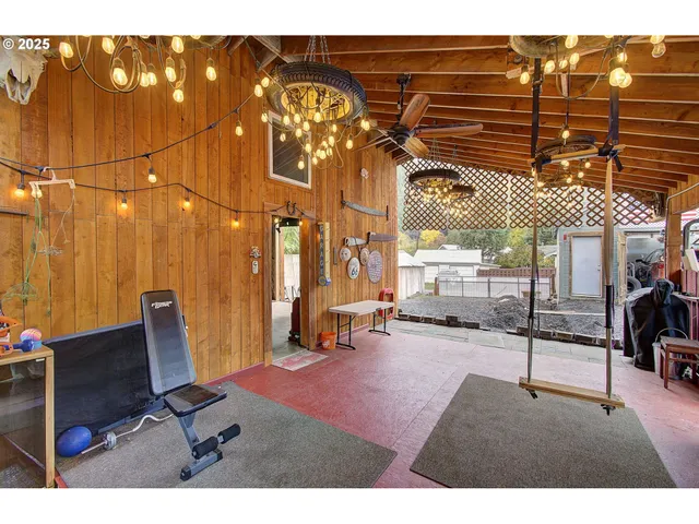 a view of a patio with table and chairs