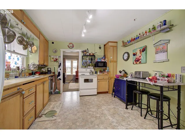 a kitchen with a cabinets and chairs
