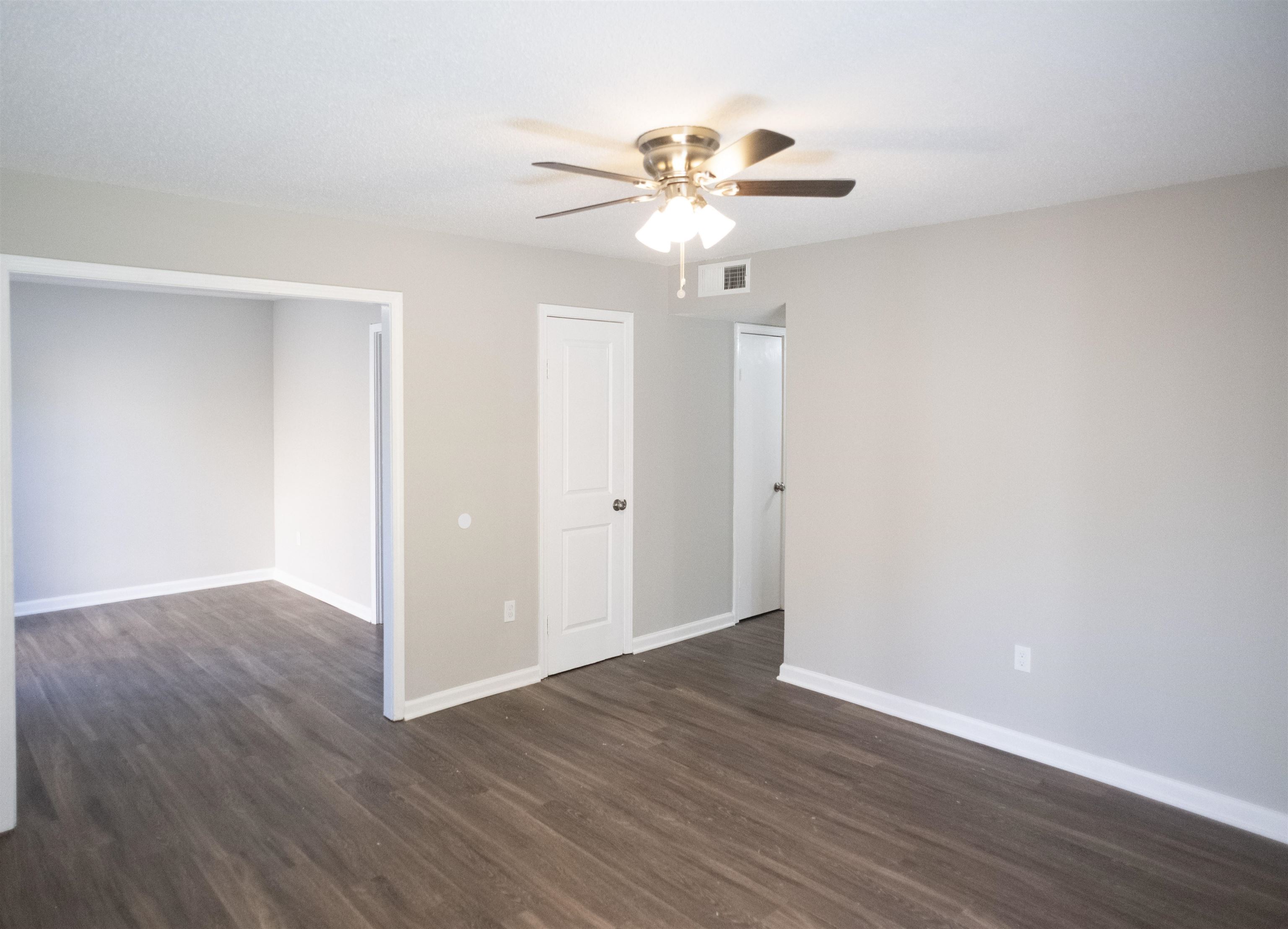 3346 Ridgemont Road Memphis, TN 38128 - Photo 5 of 12 a view of an empty room with wooden floor