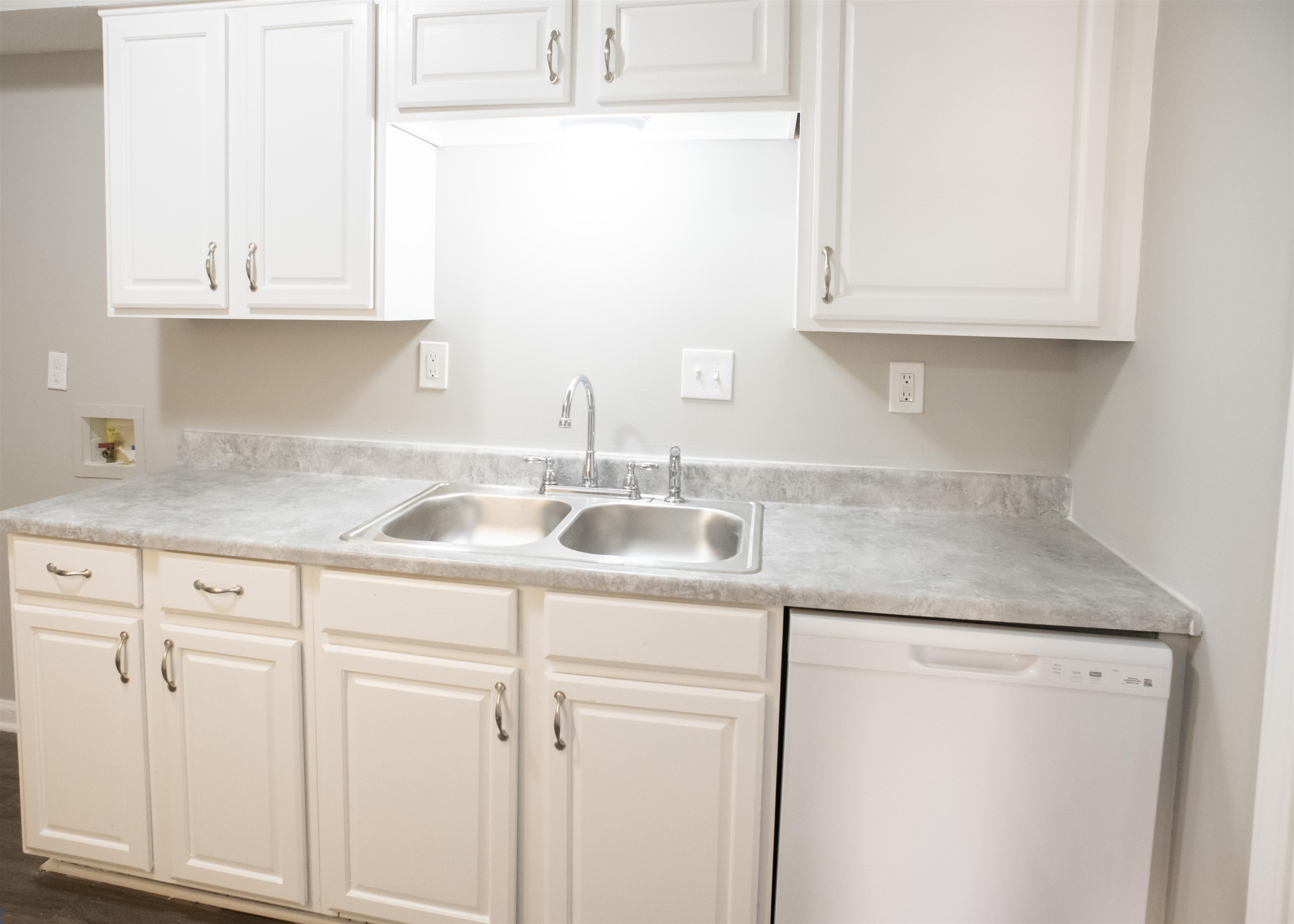 3346 Ridgemont Road Memphis, TN 38128 - Photo 8 of 12 a kitchen with granite countertop white cabinets and a sink