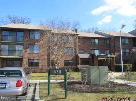 15311 Beaverbrook Court, Unit 902G Silver Spring, MD 20906 - Photo 1 of 10 a front view of a house with garden