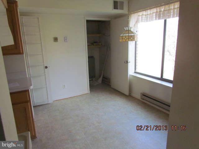 15311 Beaverbrook Court, Unit 902G Silver Spring, MD 20906 - Photo 4 of 10 a view of an empty room with a window