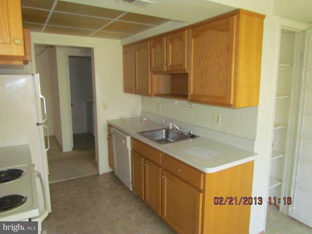15311 Beaverbrook Court, Unit 902G Silver Spring, MD 20906 - Photo 6 of 10 a bathroom with a sink and a mirror