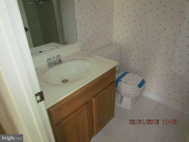 15311 Beaverbrook Court, Unit 902G Silver Spring, MD 20906 - Photo 9 of 10 a bathroom with a sink and a toilet