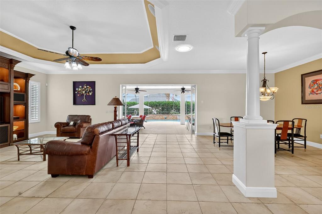 1850 Lake Ridge Drive The Villages, FL 32162 - Photo 23 of 70 a living room with furniture a ceiling fan and a window