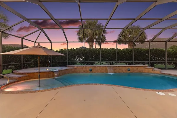 a view of a swimming pool with a patio