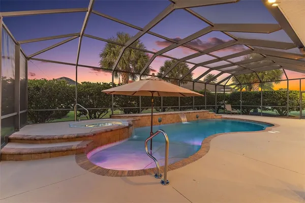 a view of a swimming pool with a patio