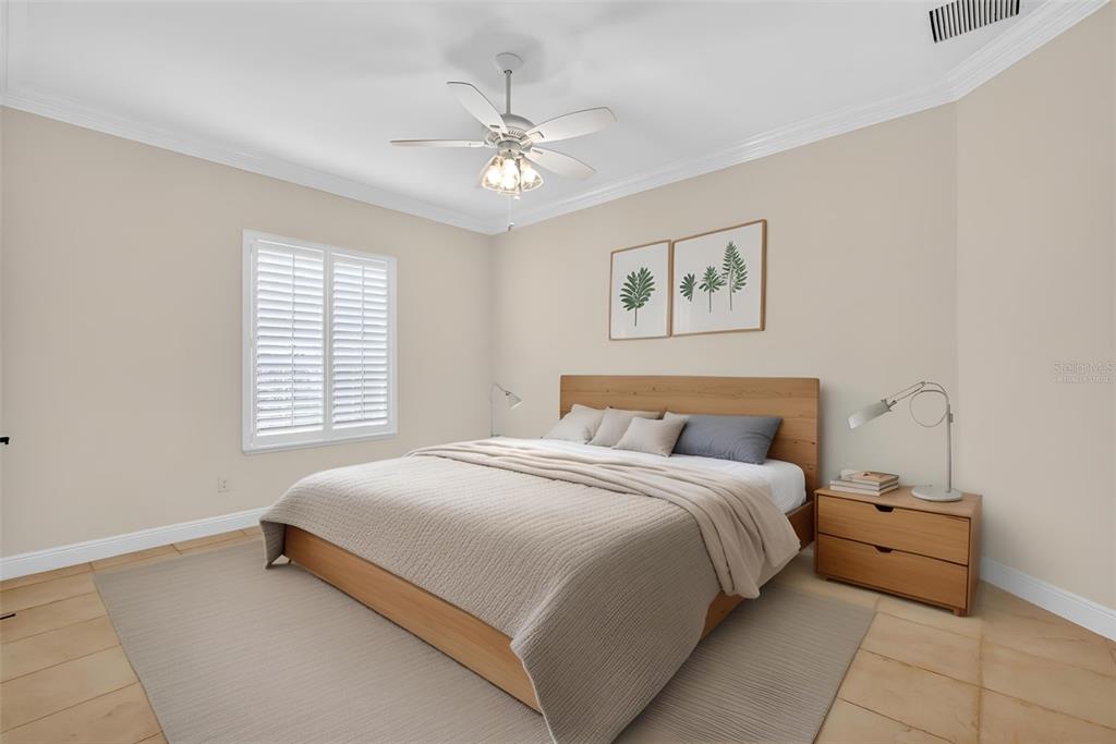 1850 Lake Ridge Drive The Villages, FL 32162 - Photo 47 of 70 a bedroom with a bed and a chandelier