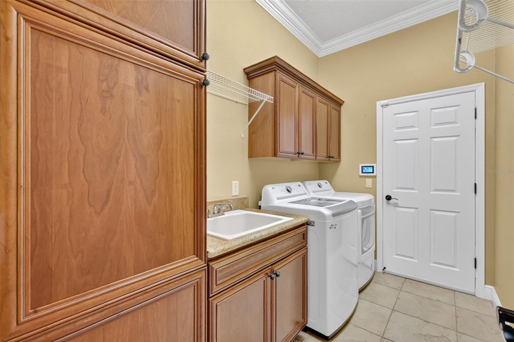1850 Lake Ridge Drive The Villages, FL 32162 - Photo 56 of 70 a utility room with dryer and washer