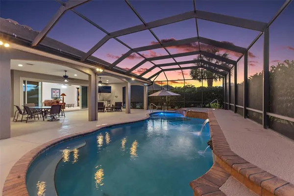 a view of a swimming pool with a patio