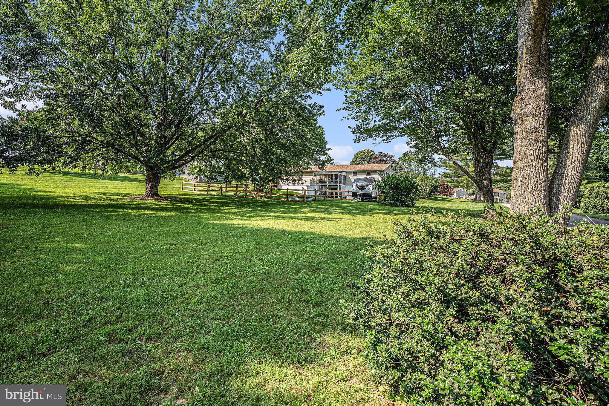 428 Pusey Mill Road Cochranville, PA 19330 - Photo 24 of 26 a big yard with lots of green space and trees