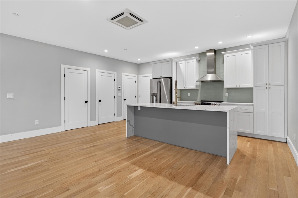 54 River Street, Unit 2 Boston, MA 02126 - Photo 2 of 16 a view of kitchen with wooden floor
