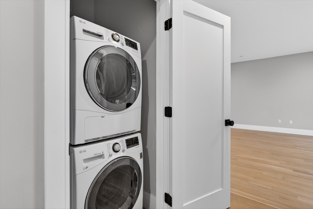 54 River Street, Unit 2 Boston, MA 02126 - Photo 8 of 16 a utility room with dryer and washer