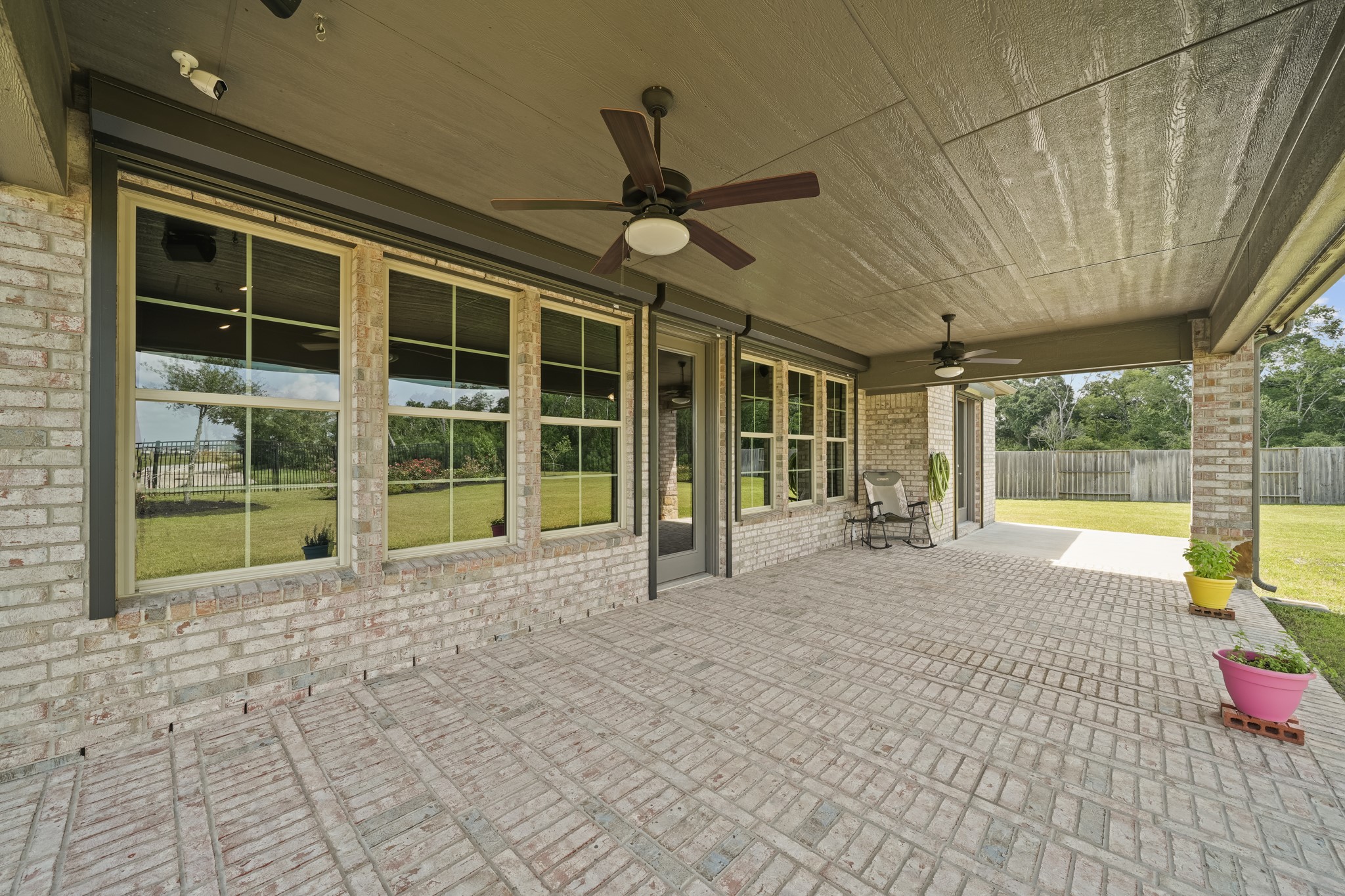 5739 Bobwhite Trail Manvel, TX 77578 - Photo 23 of 29 From the patio, take in serene views of the lush backyard and professionally landscaped grounds. It's the perfect place to unwind while enjoying the peaceful surroundings.