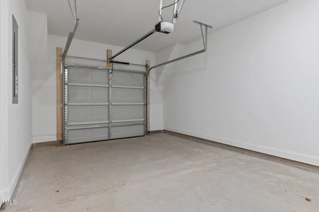 a view of an empty room with a white cabinet