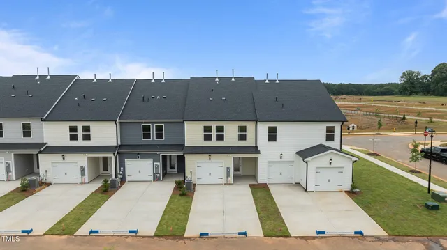 an aerial view of a house with swimming pool