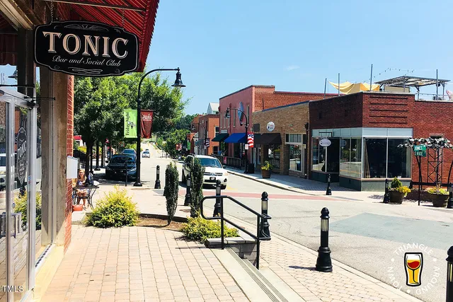 a view of a street with sitting area