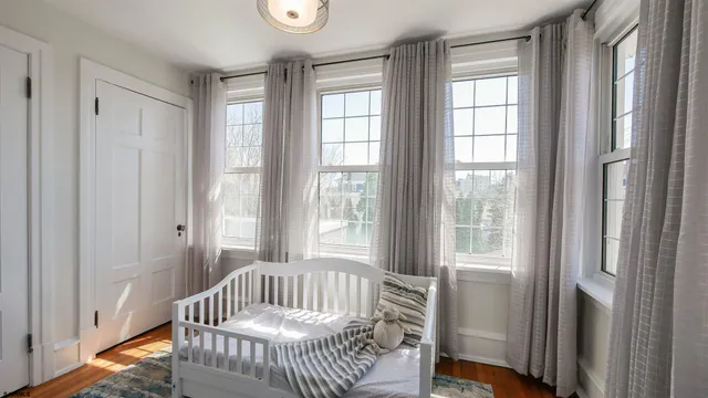 a bedroom with furniture and windows