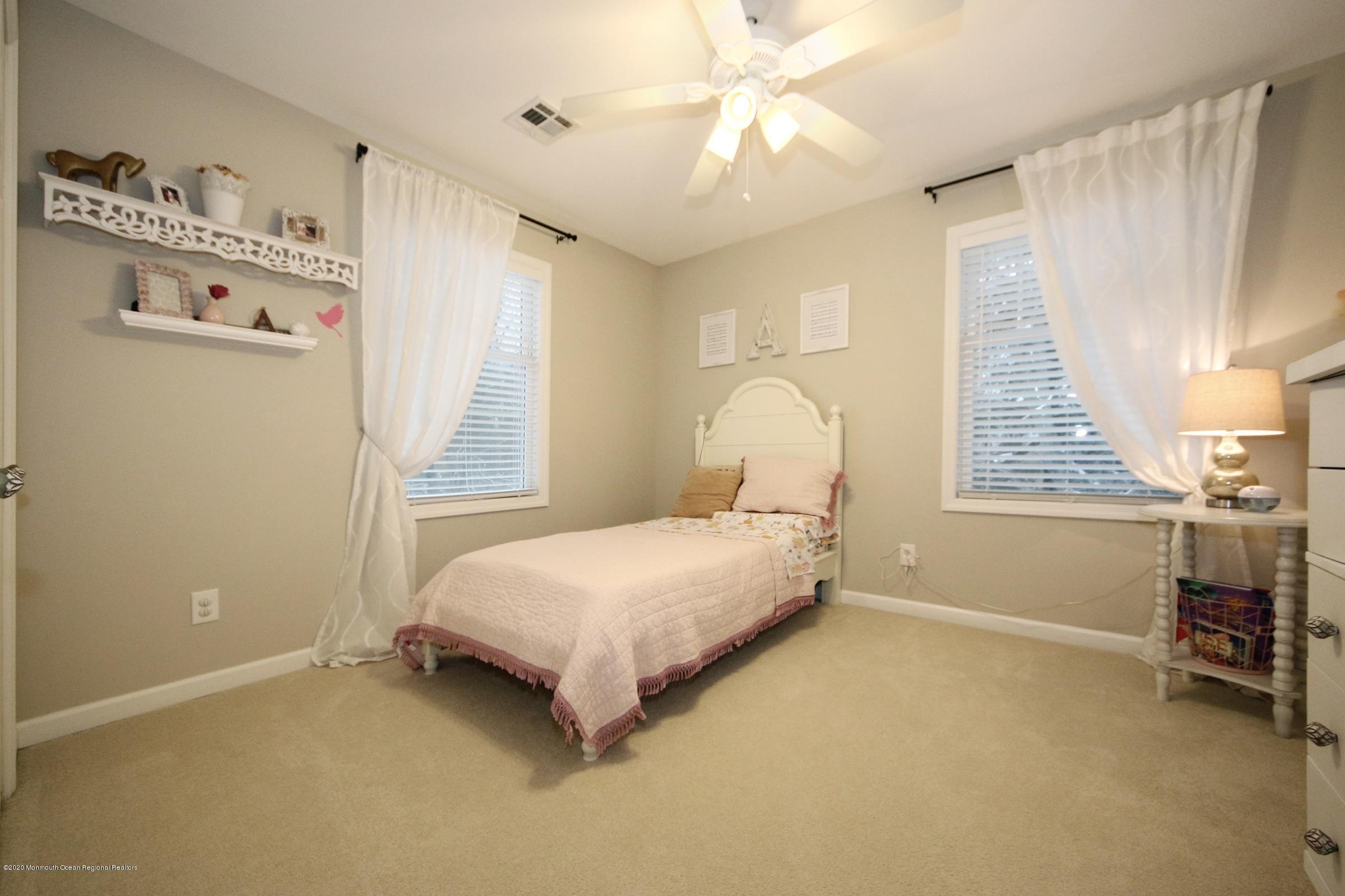 600 E Road Middletown, NJ 07748 - Photo 14 of 23 a bedroom with a bed and a window