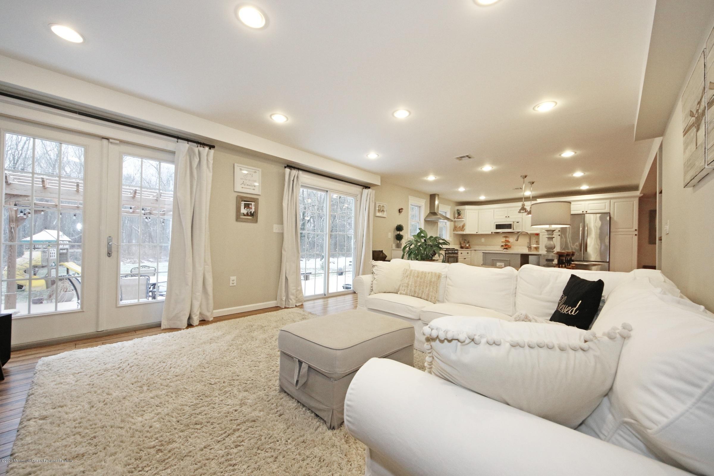 600 E Road Middletown, NJ 07748 - Photo 8 of 23 a living room with furniture and a large window
