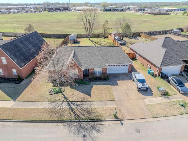 an aerial view of a house with a ocean view