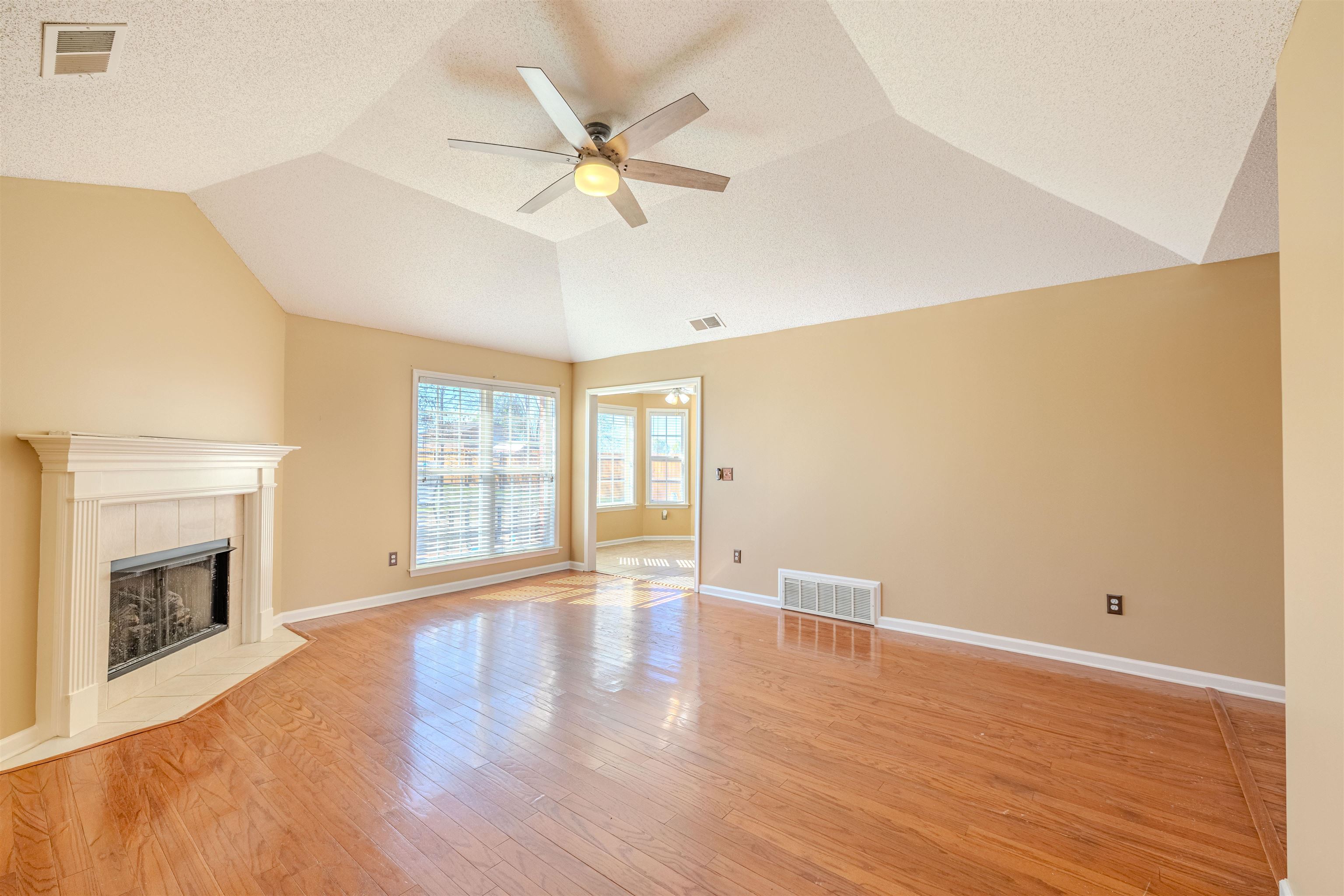 5991 Marley Street Arlington, TN 38002 - Photo 11 of 30 a view of an empty room with wooden floor and a window