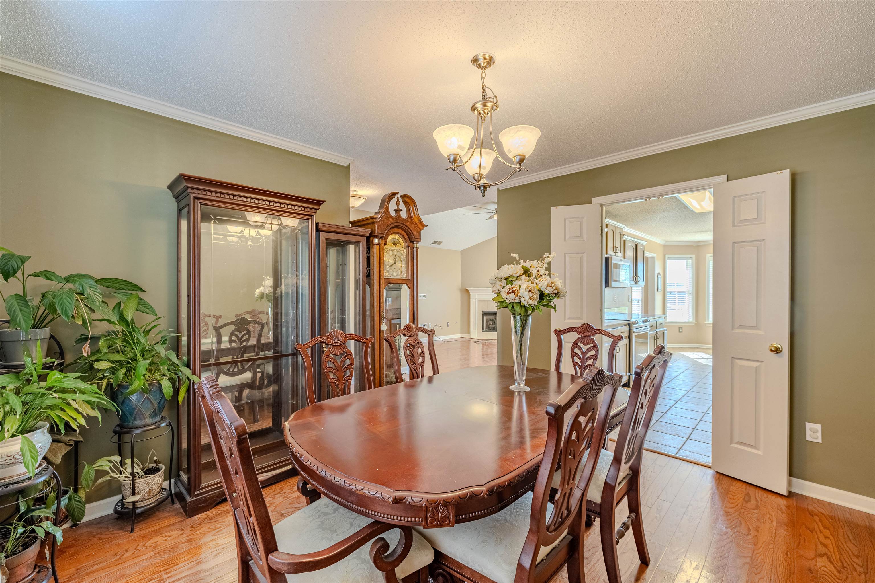 5991 Marley Street Arlington, TN 38002 - Photo 2 of 30 a dining room with furniture potted plants and wooden floor
