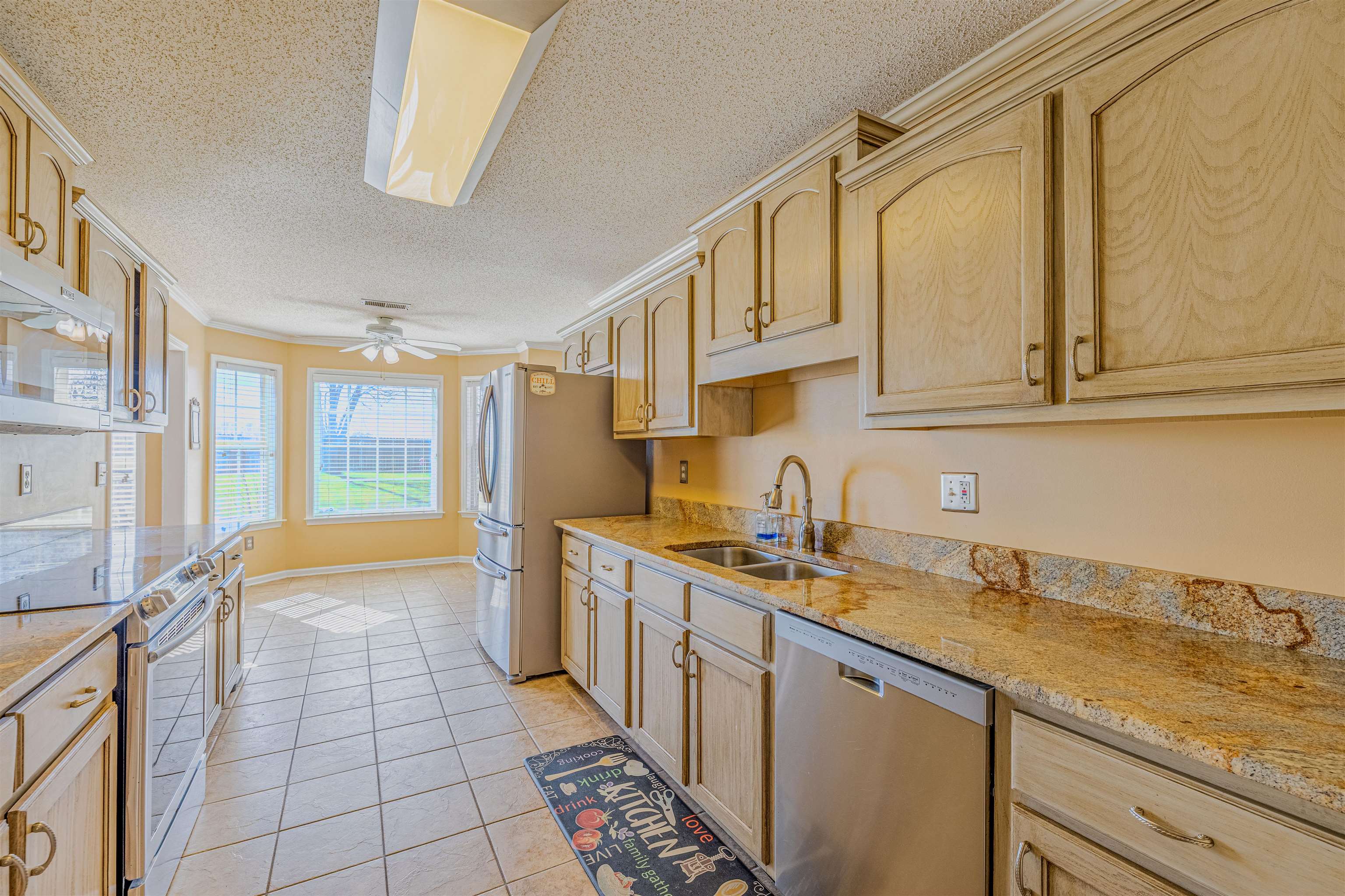 5991 Marley Street Arlington, TN 38002 - Photo 6 of 30 a kitchen with stainless steel appliances granite countertop a sink and cabinets