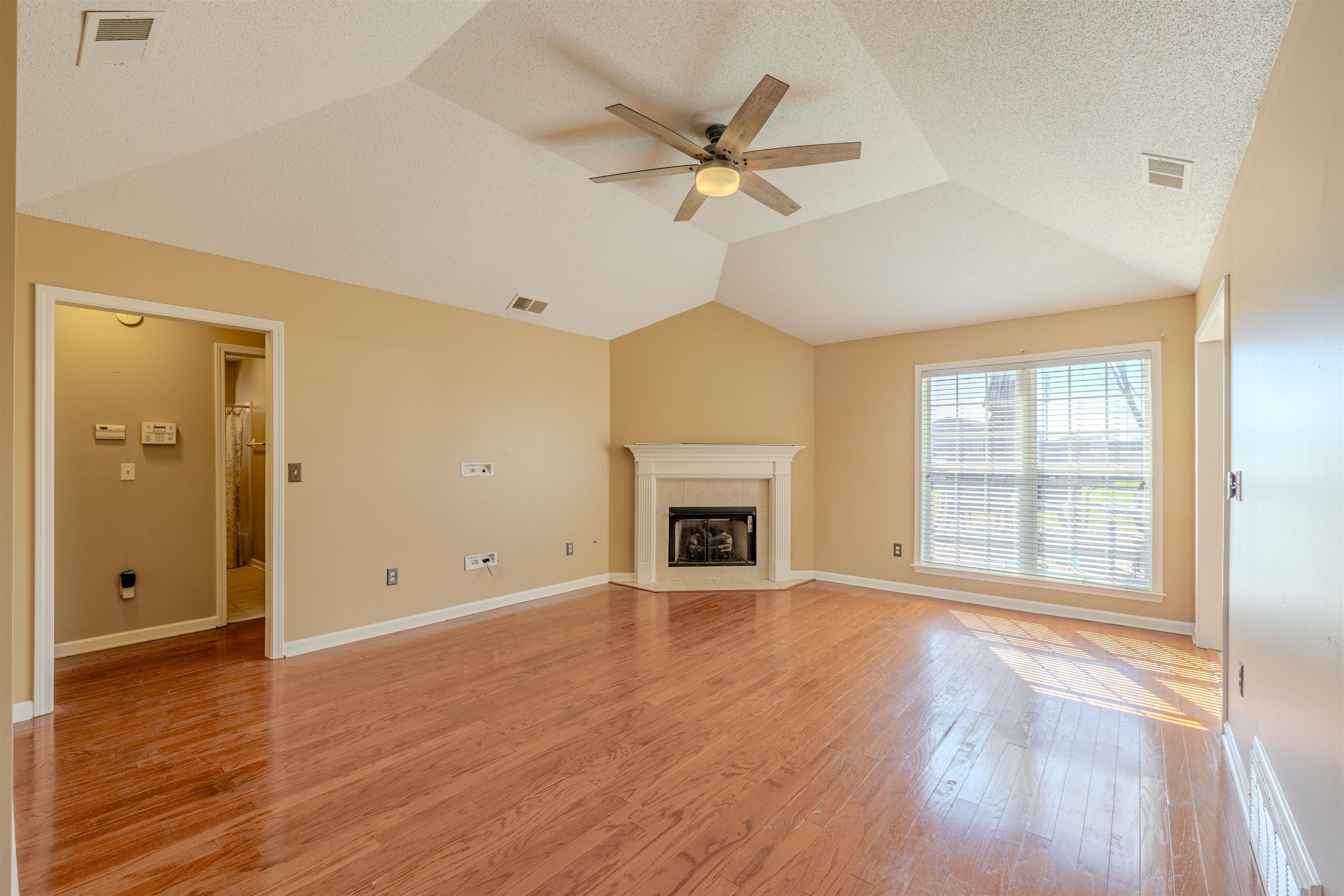 5991 Marley Street Arlington, TN 38002 - Photo 9 of 30 a view of an empty room with a window and wooden floor