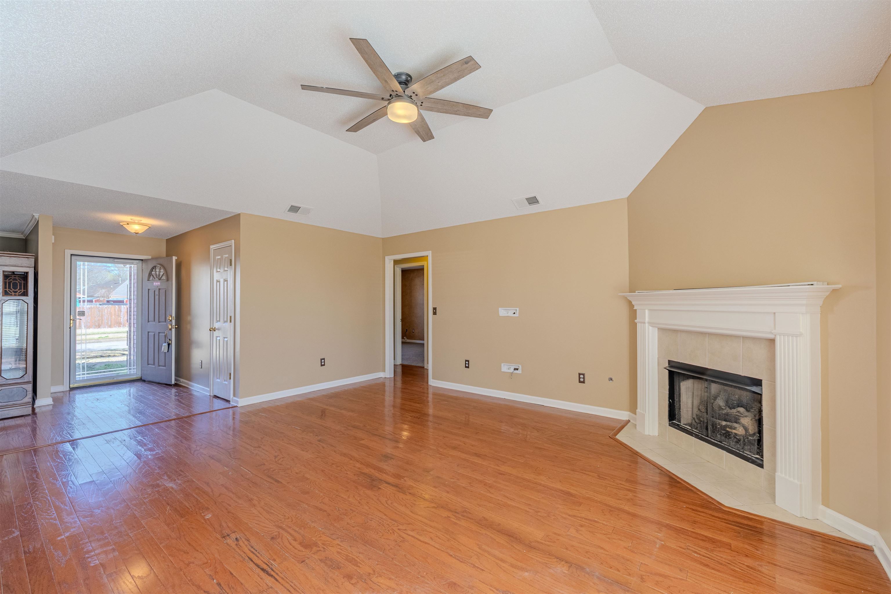 5991 Marley Street Arlington, TN 38002 - Photo 10 of 30 a view of an empty room with a fireplace and a window