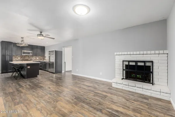 a kitchen with stainless steel appliances a stove top oven and cabinets
