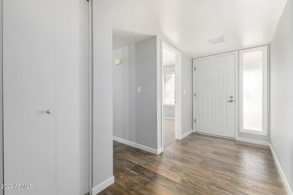 a view of entryway with wooden floor