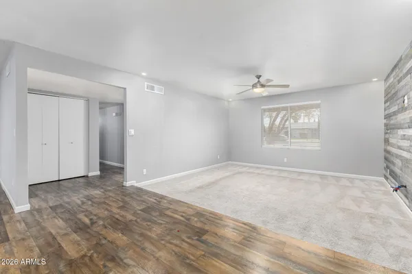 a view of an empty room with a window