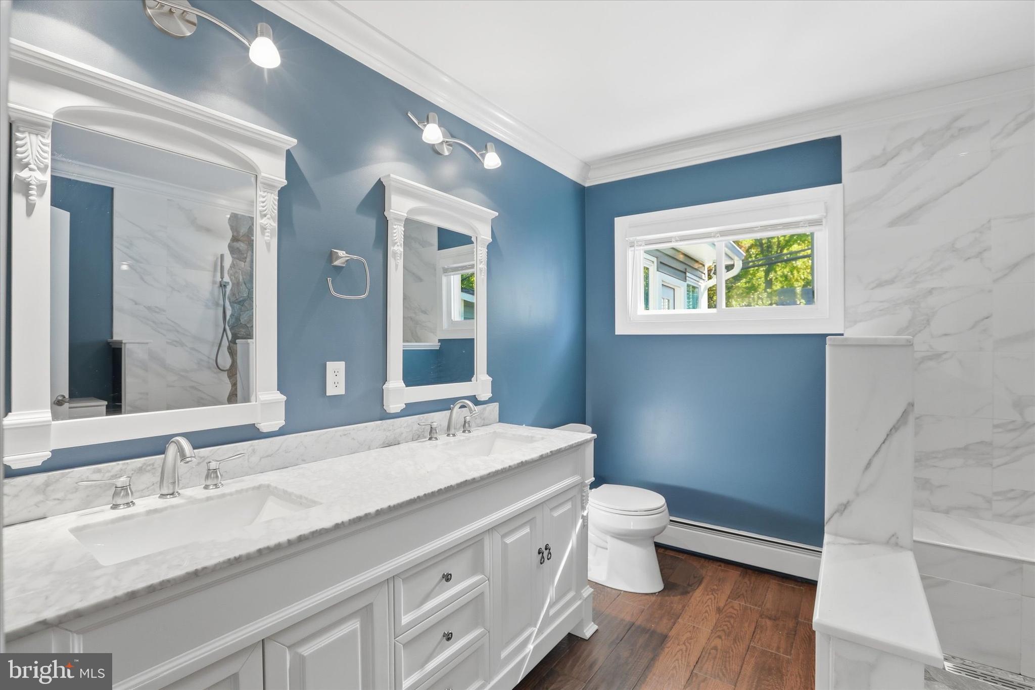 38 Violet Road Levittown, PA 19057 - Photo 15 of 29 a bathroom with a double vanity sink toilet and a mirror