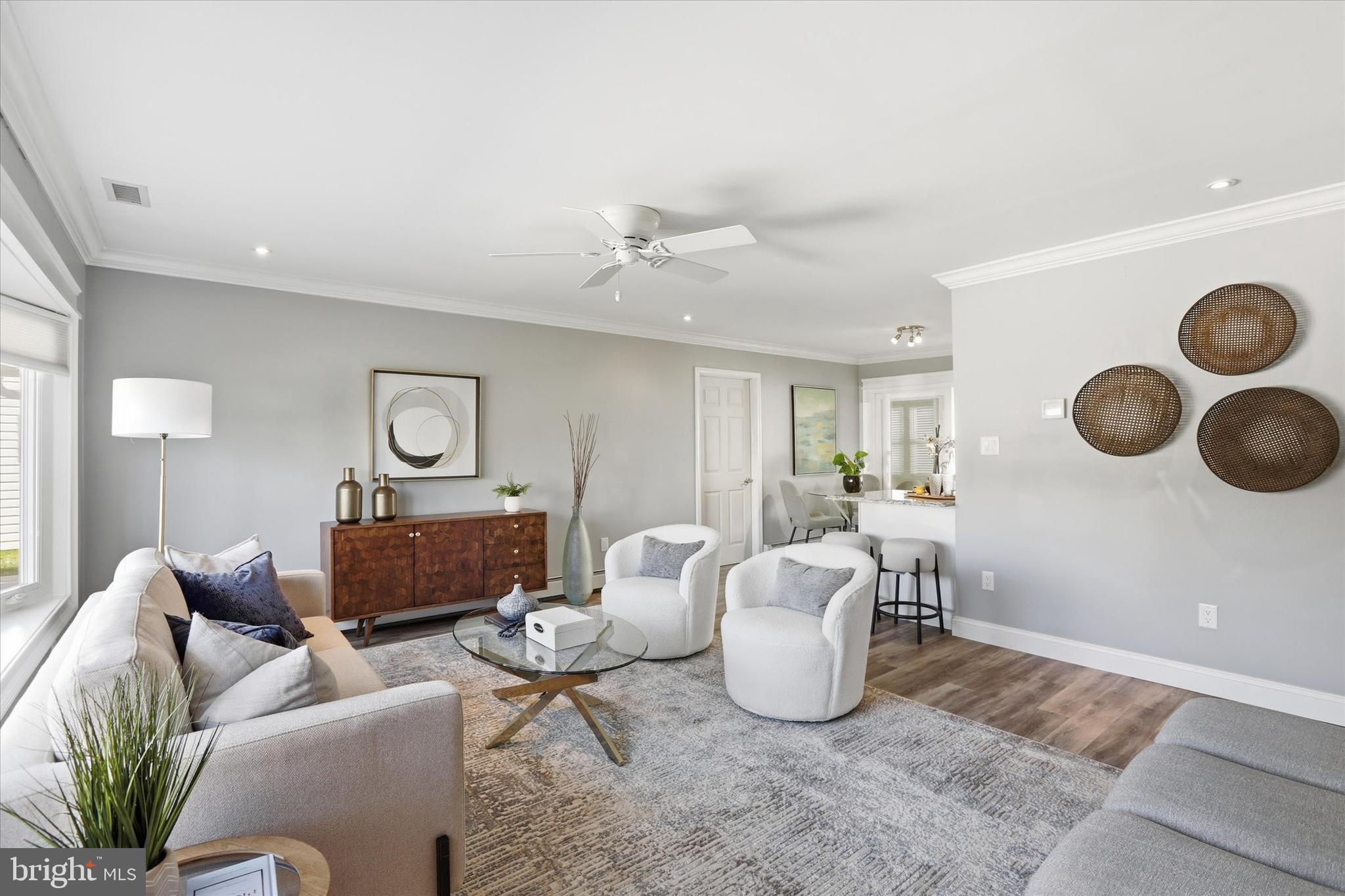 38 Violet Road Levittown, PA 19057 - Photo 5 of 29 a living room with furniture and a clock