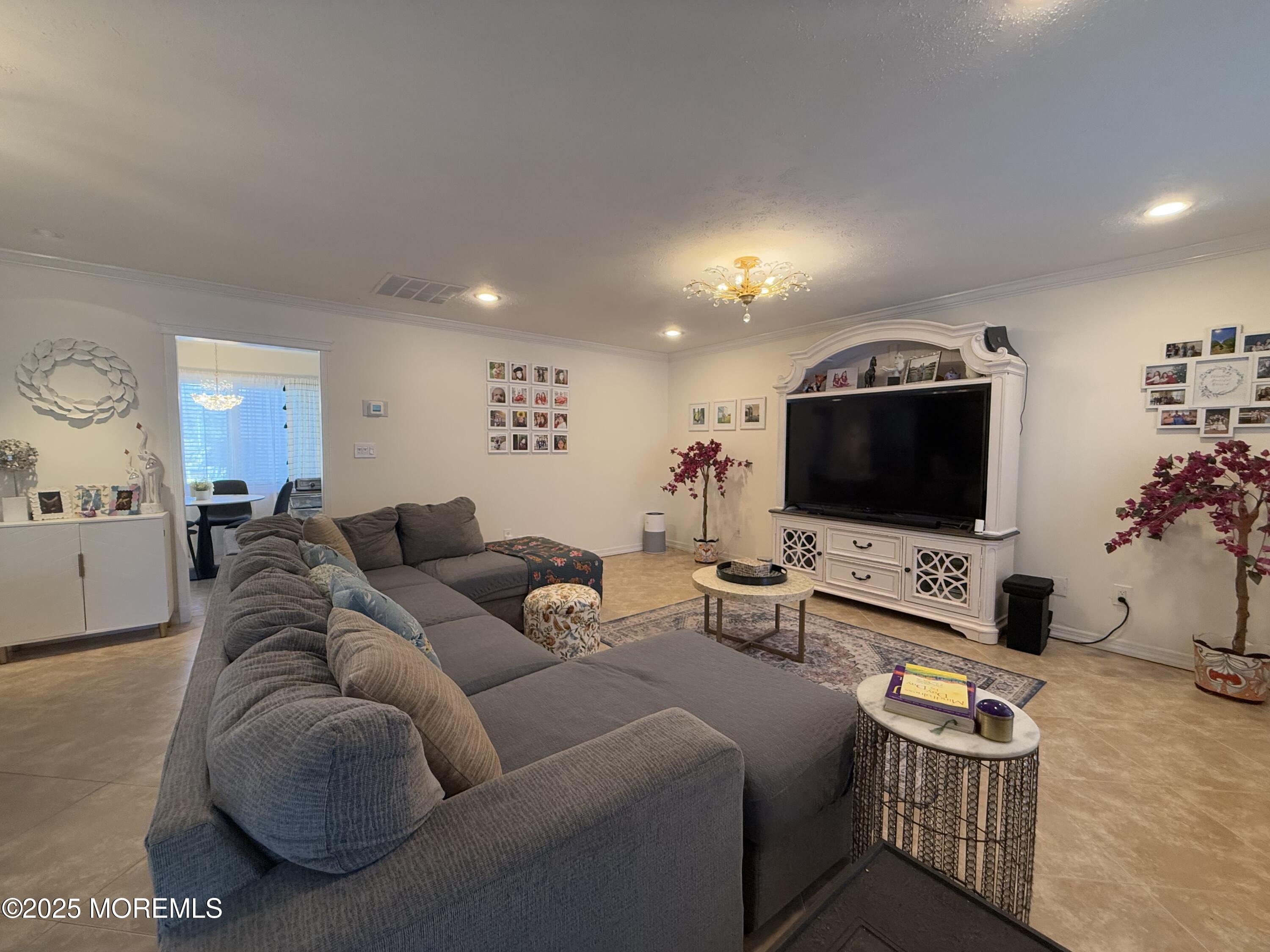 20 Long Road Freehold, NJ 07728 - Photo 9 of 20 a living room with furniture and a flat screen tv