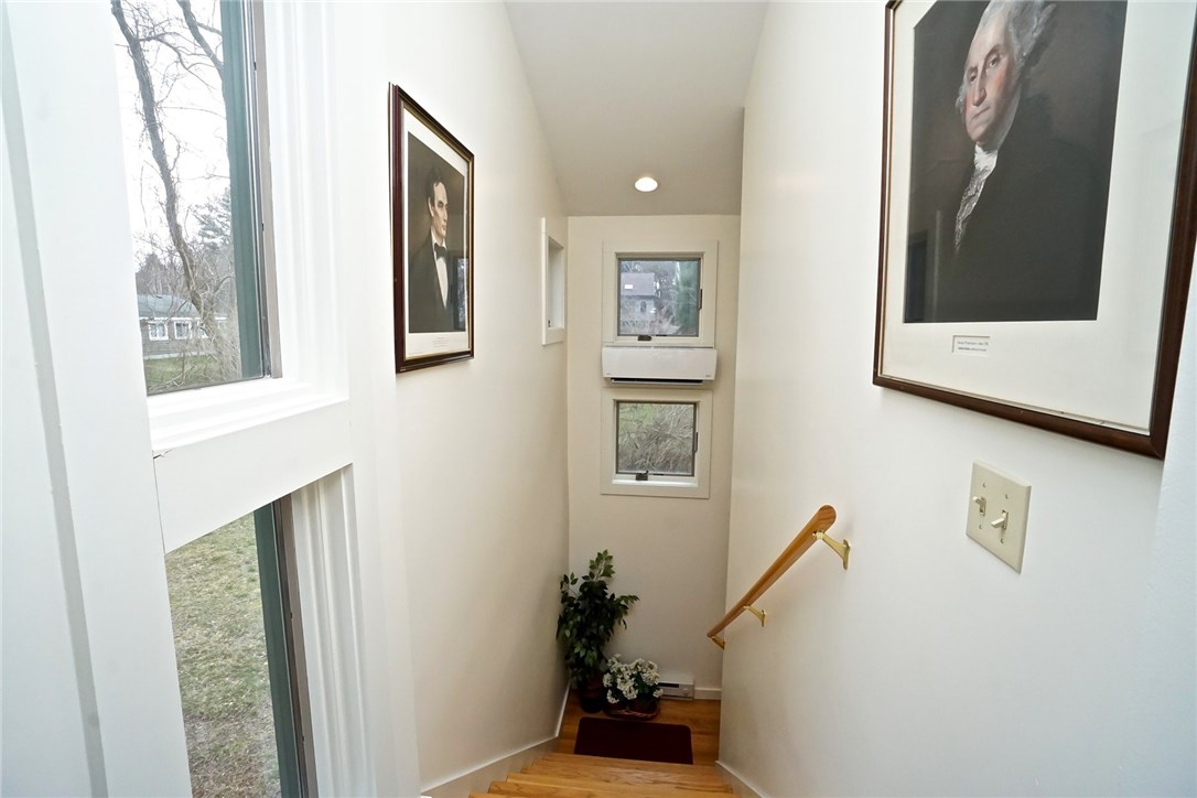 7 Ship Street Jamestown, RI 02835 - Photo 11 of 27 These stairs take you to the ground level oversized Garage!