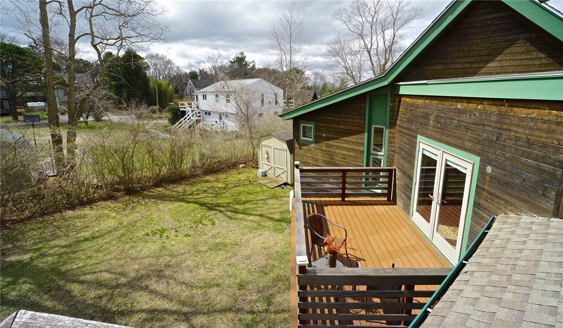 7 Ship Street Jamestown, RI 02835 - Photo 19 of 27 From the upper Deck, you can see the first level Deck, and one of two outbuildings on this property!