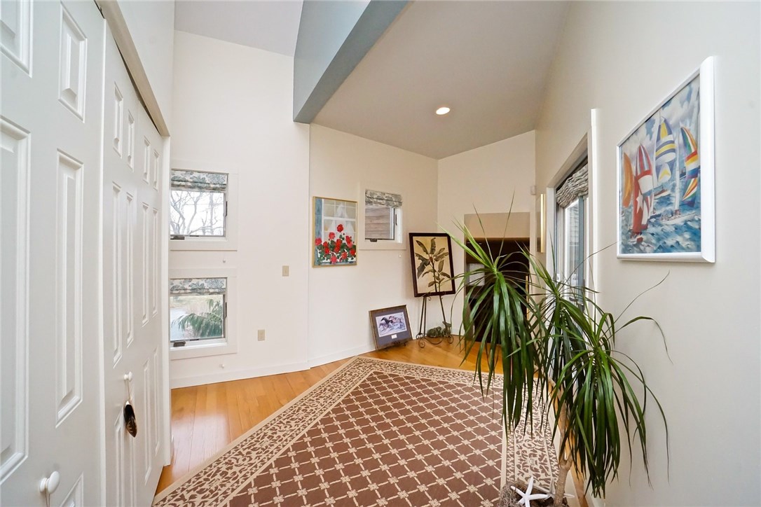 7 Ship Street Jamestown, RI 02835 - Photo 7 of 27 An addition in 2012 added this hallway with amazing closets and space, a Deck, access to the oversized Garage, an Owner en Suite!