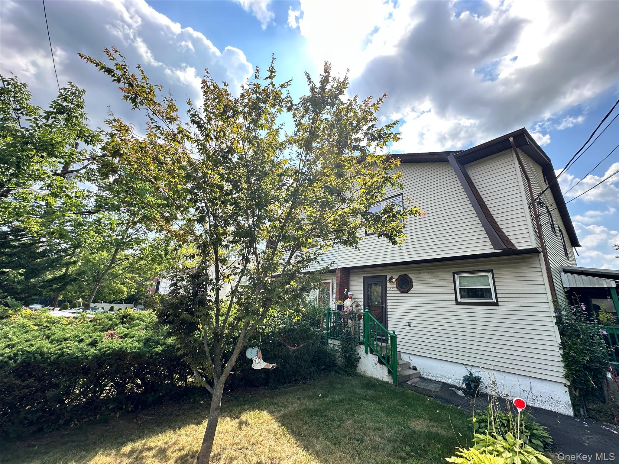 76 Division Avenue Spring Valley, NY 10977 - Photo 1 of 1 a view of a house with a yard
