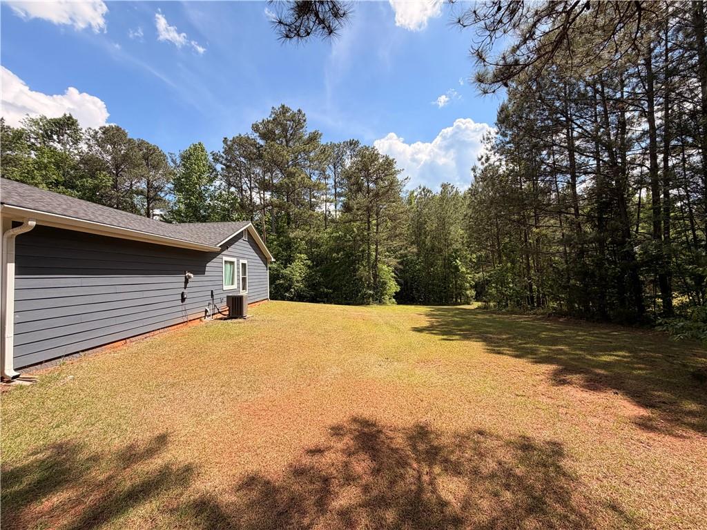 145 Stoneview Circle Covington, GA 30016 - Photo 12 of 41 a view of a house with a yard