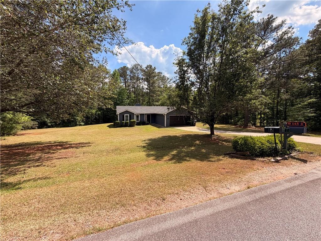 145 Stoneview Circle Covington, GA 30016 - Photo 15 of 41 a view of a yard with a house