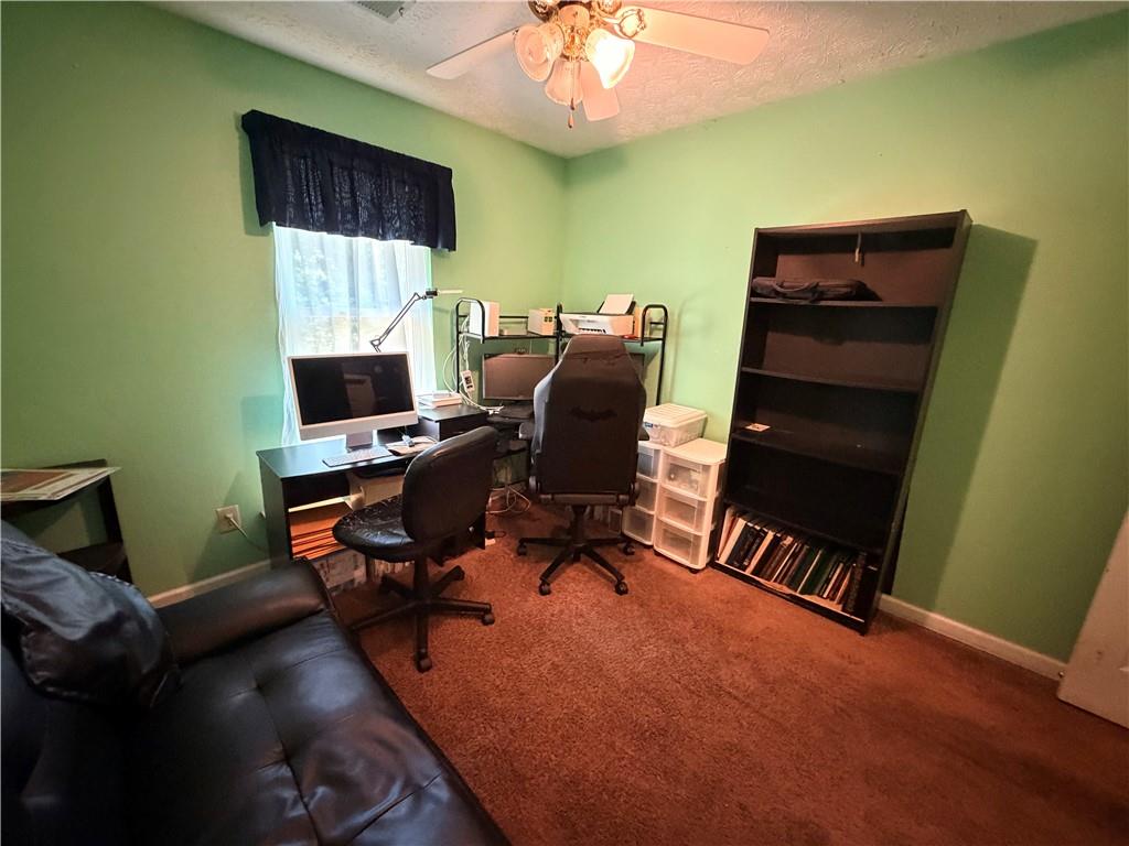 145 Stoneview Circle Covington, GA 30016 - Photo 19 of 41 a view of a workspace with furniture