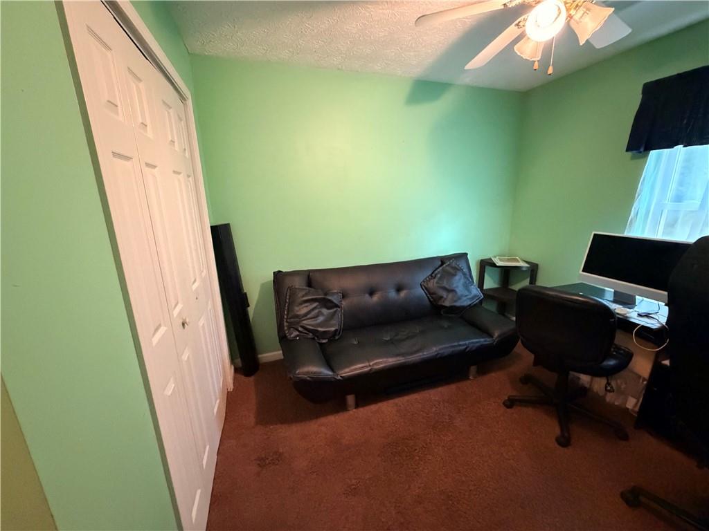 145 Stoneview Circle Covington, GA 30016 - Photo 20 of 41 a living room with furniture and a wooden floor