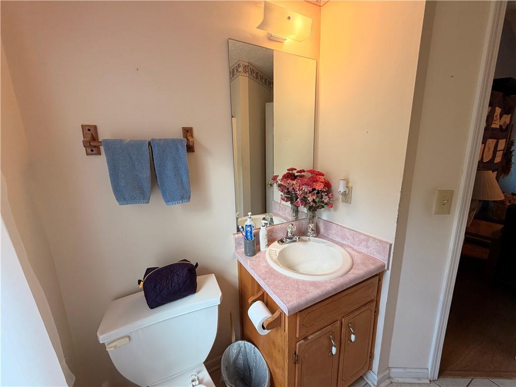 145 Stoneview Circle Covington, GA 30016 - Photo 24 of 41 a bathroom with a sink a toilet and mirror