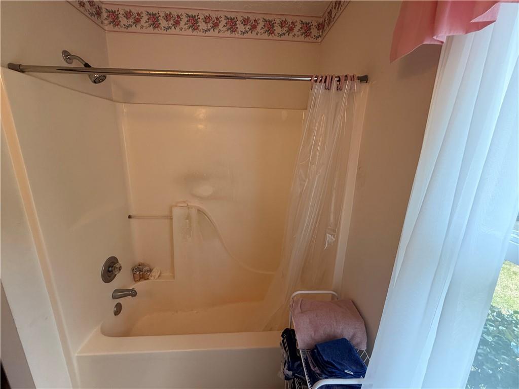145 Stoneview Circle Covington, GA 30016 - Photo 25 of 41 a bathroom with a shower and a bath tub