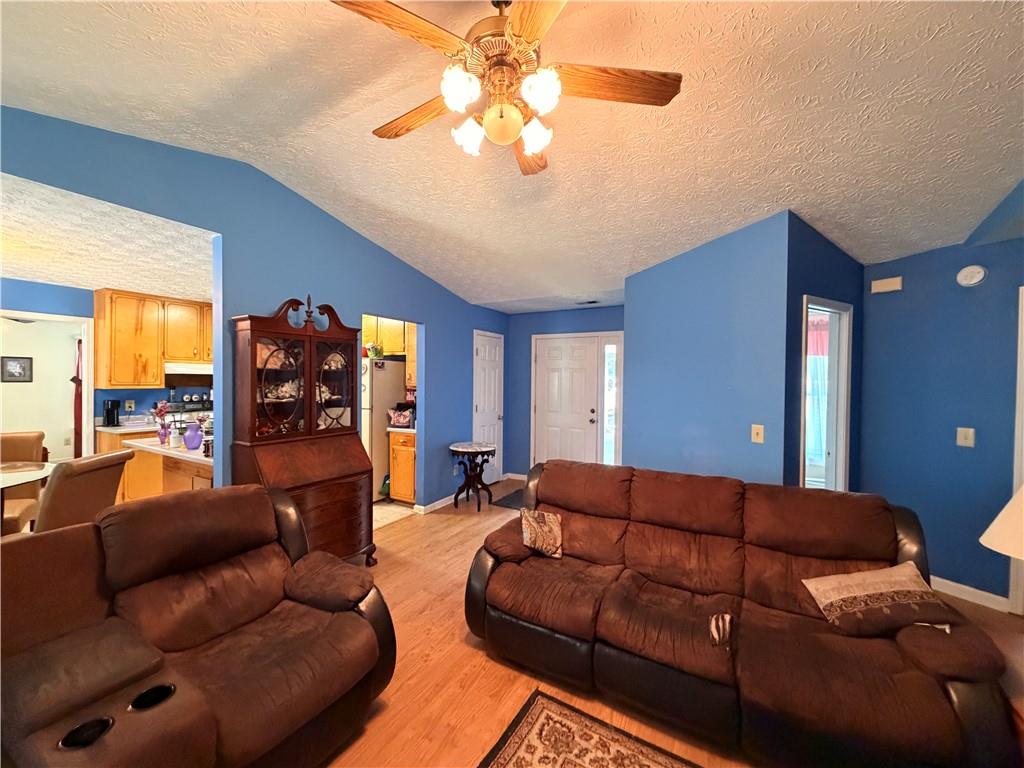 145 Stoneview Circle Covington, GA 30016 - Photo 27 of 41 a living room with furniture and a large window