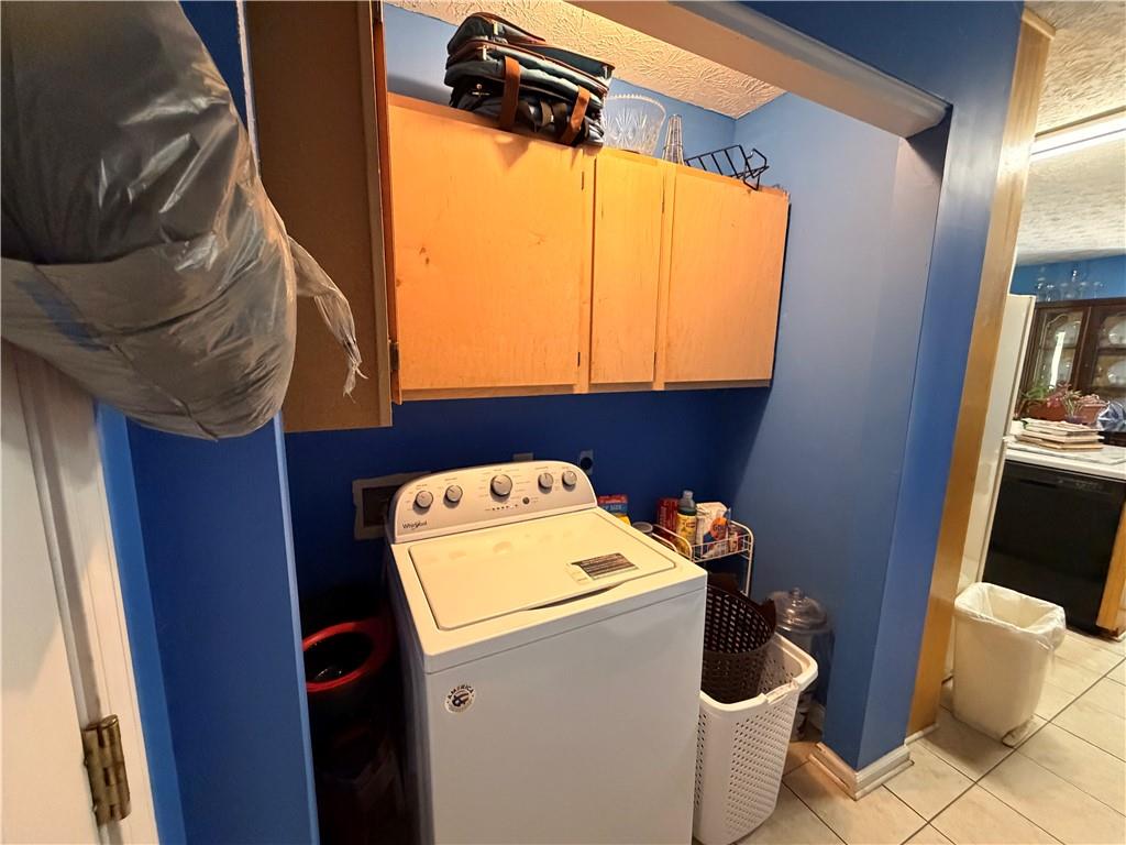 145 Stoneview Circle Covington, GA 30016 - Photo 35 of 41 a utility room with dryer and washer